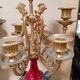 Pair of six-light candelabra in patinated and gilded bronze and spelter.