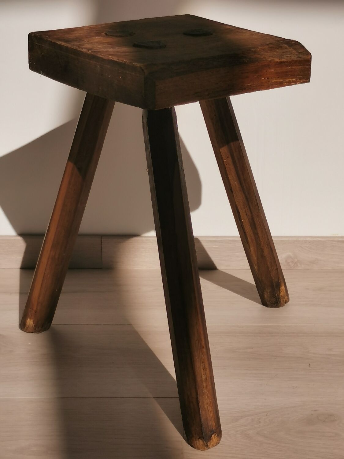 Old wooden stool tripods