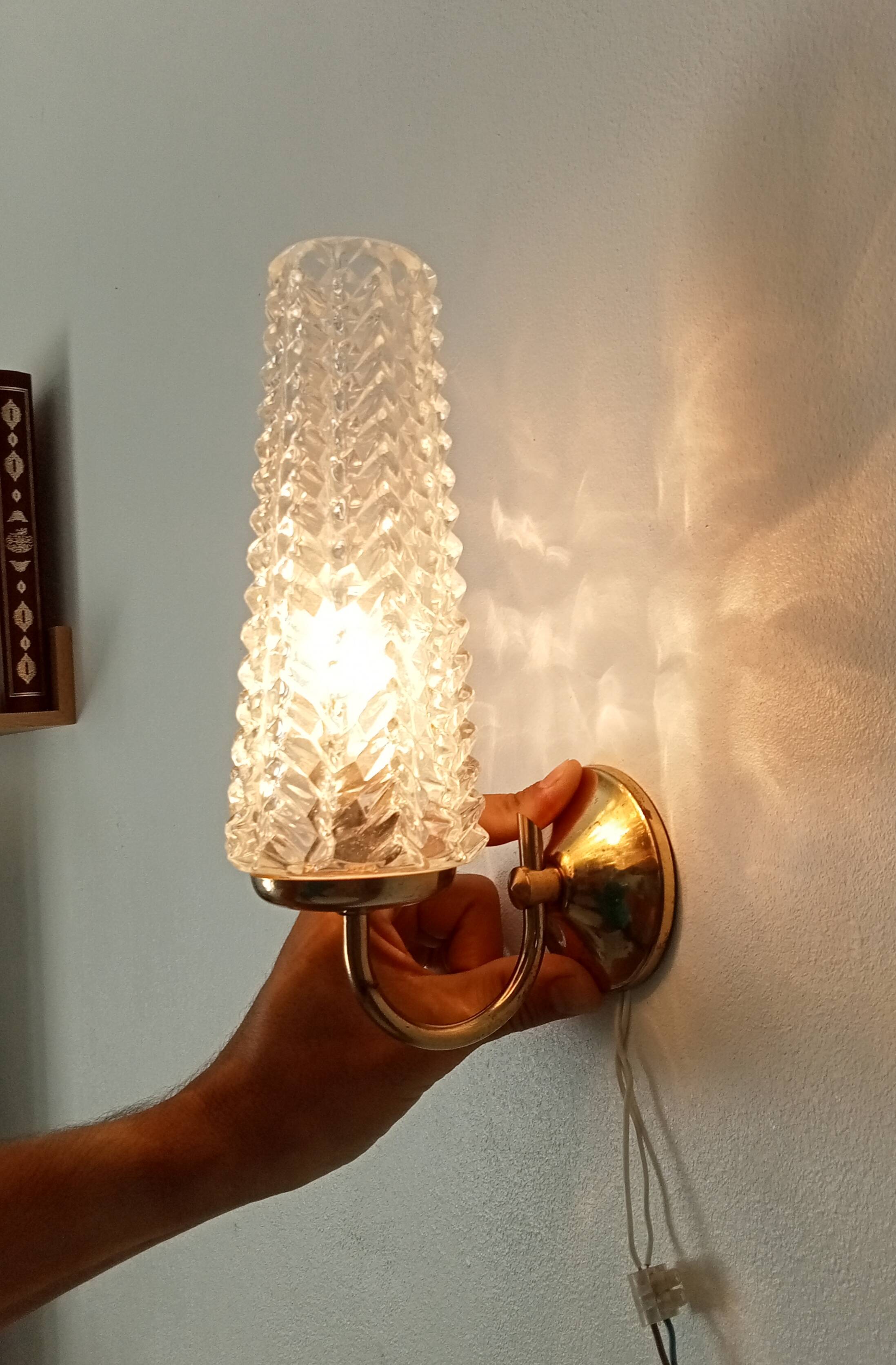 Vintage wall light in brass and etched glass.