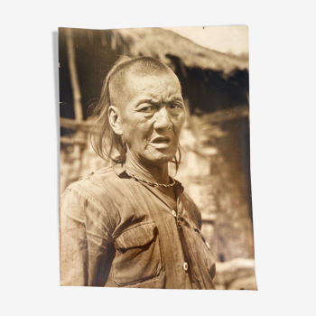 Black and white photo portrait of Asian tribal man 1900