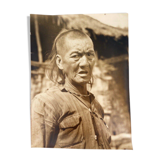 Black and white photo portrait of Asian tribal man 1900