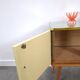 Vintage green DDR cabinet, model Libelle with glass top, slanted legs.