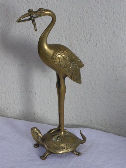 Heron in brass on the back of a turtle, press paper, vintage 1970