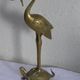 Heron in brass on the back of a turtle, press paper, vintage 1970