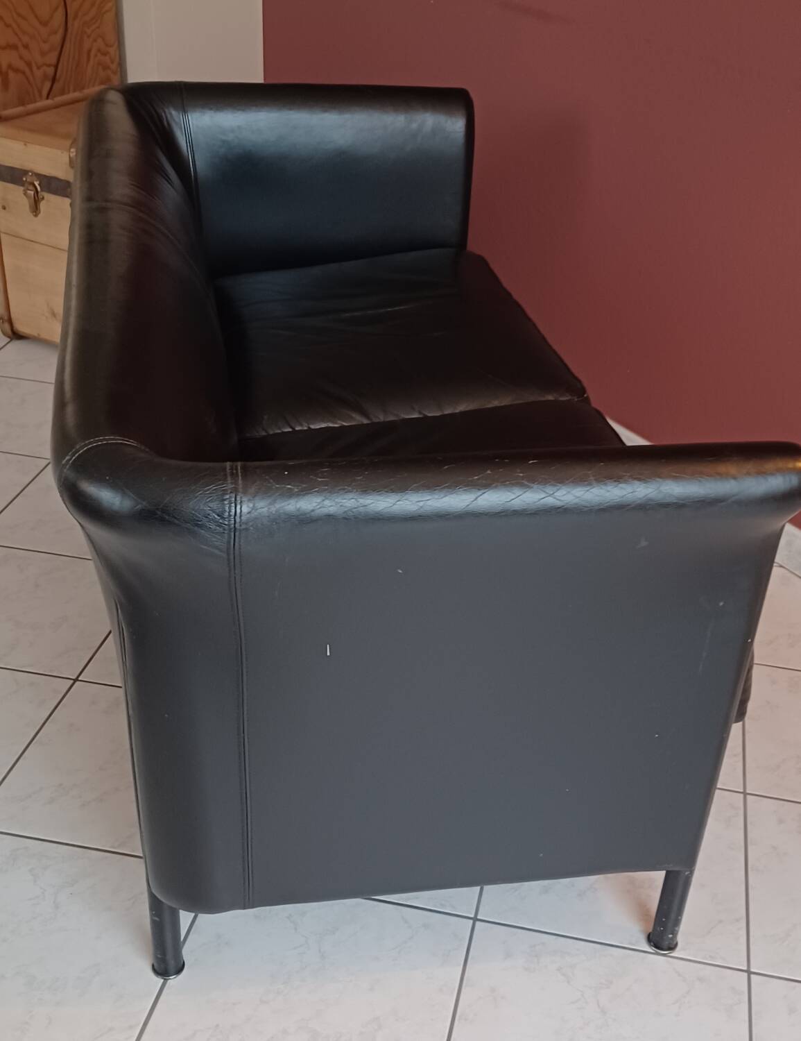 Black leather two-seater sofa