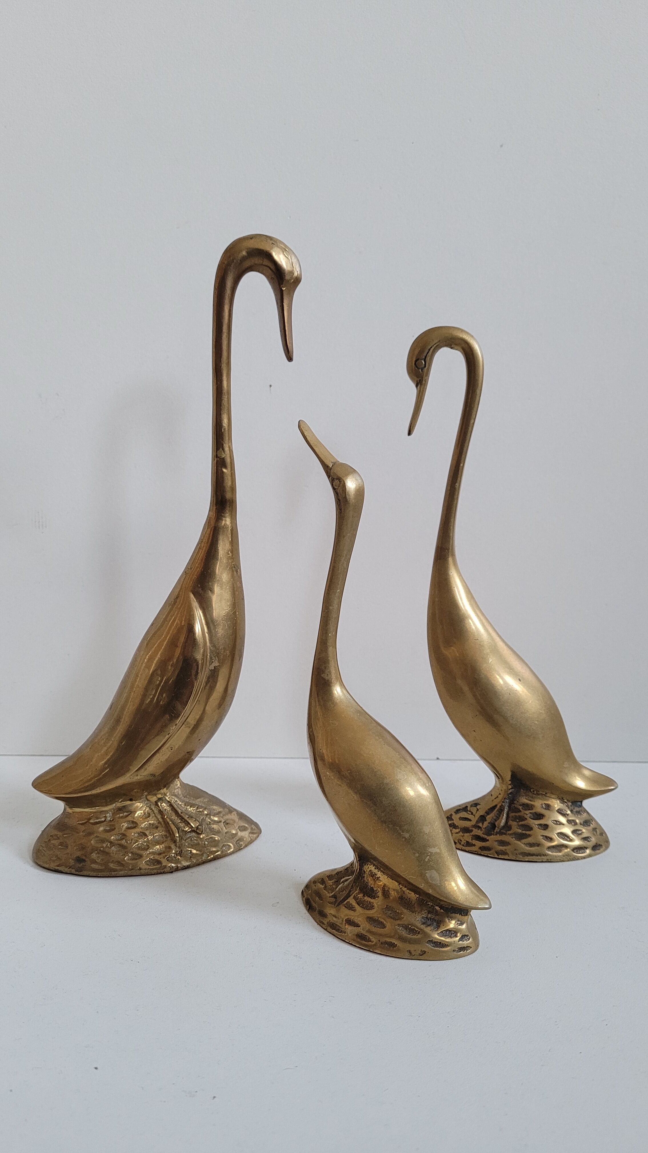 Trio of brass geese