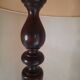 Sculptural floor lamp made of twisted turned wood.