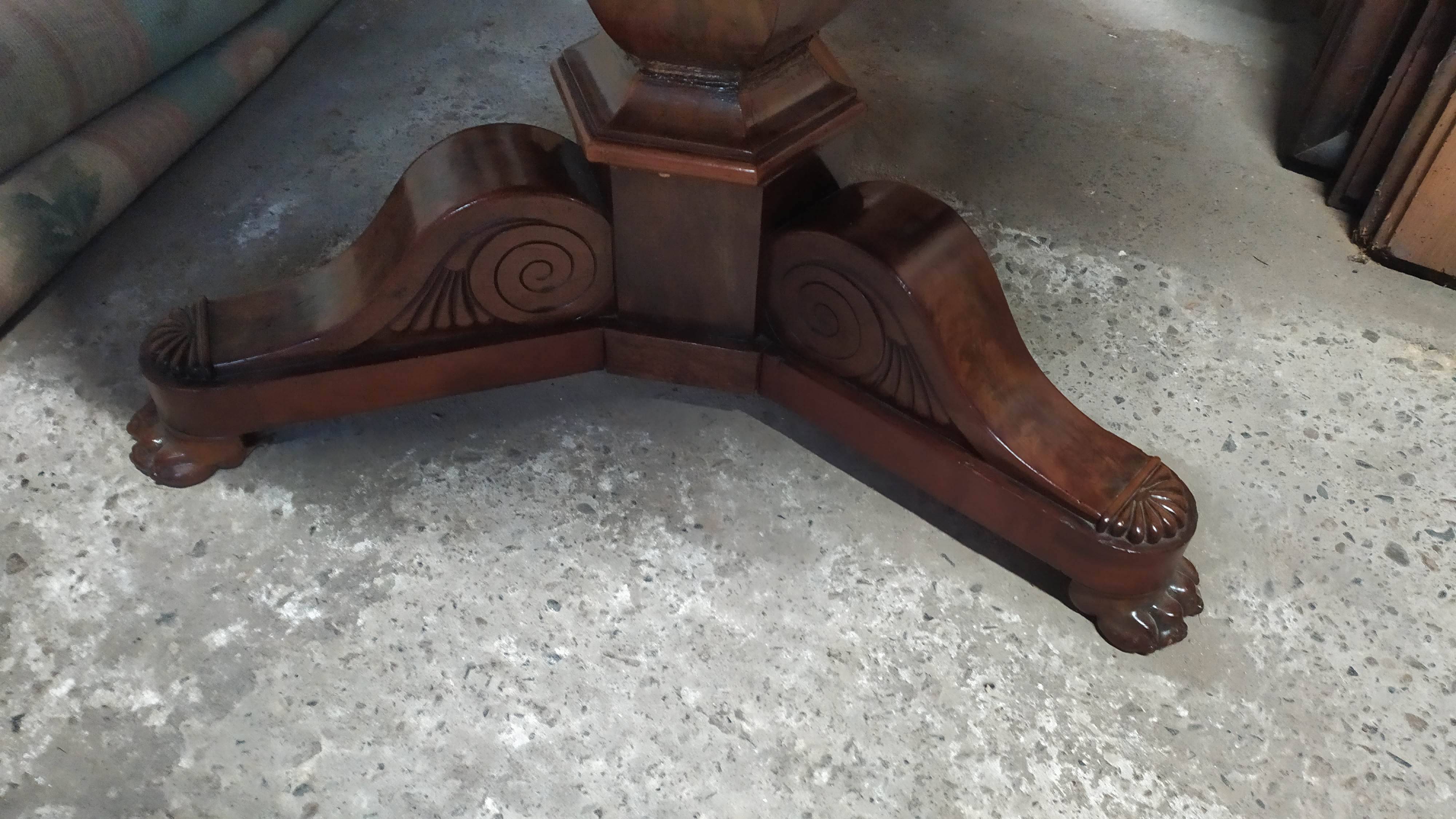 Pedestal table with gray depression marble
