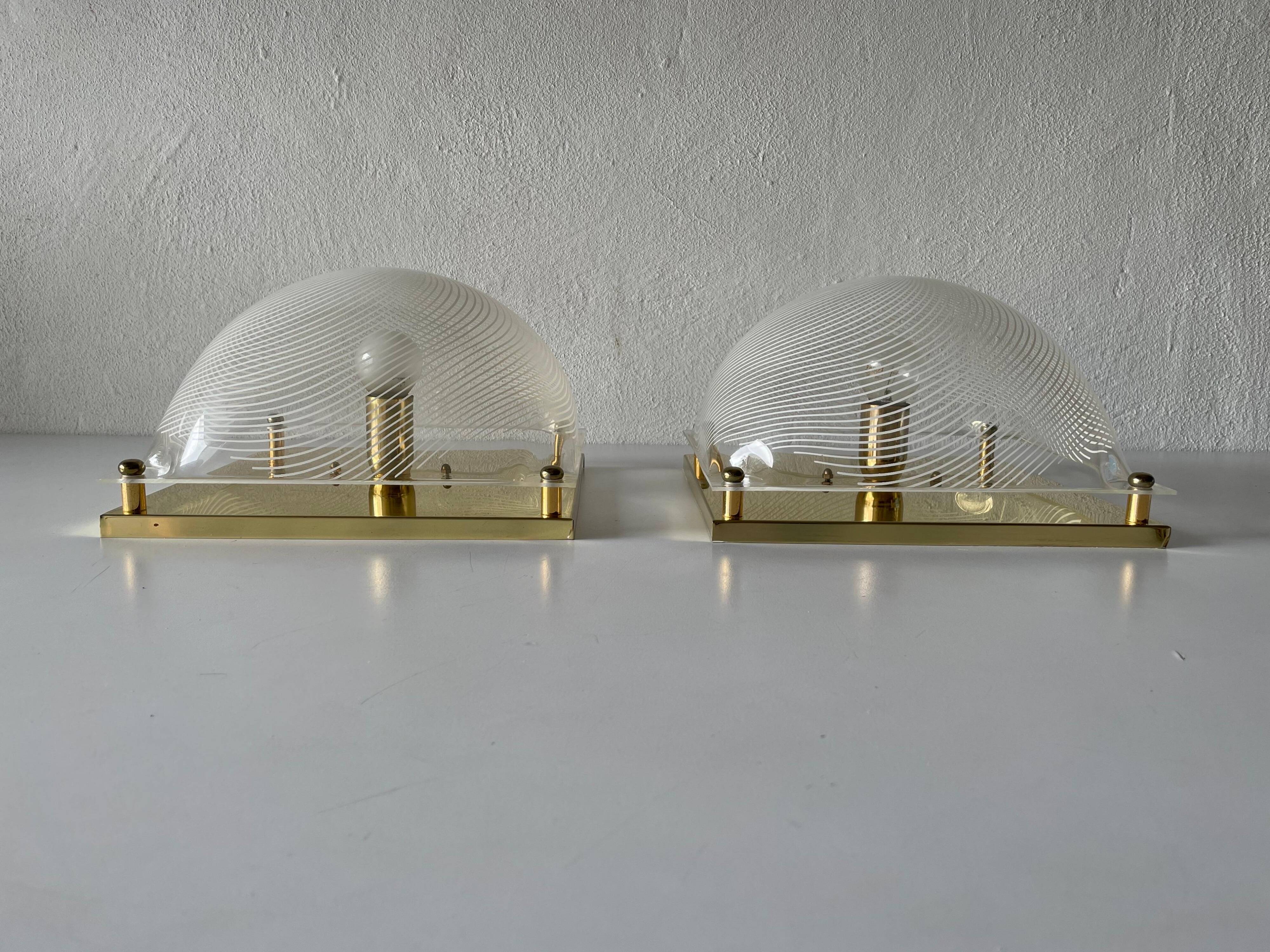 Pair of wall lights or flush mounts in plexiglass by Leola, 1970s, Germany.