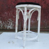 Old curved wooden stool revisited patinated white