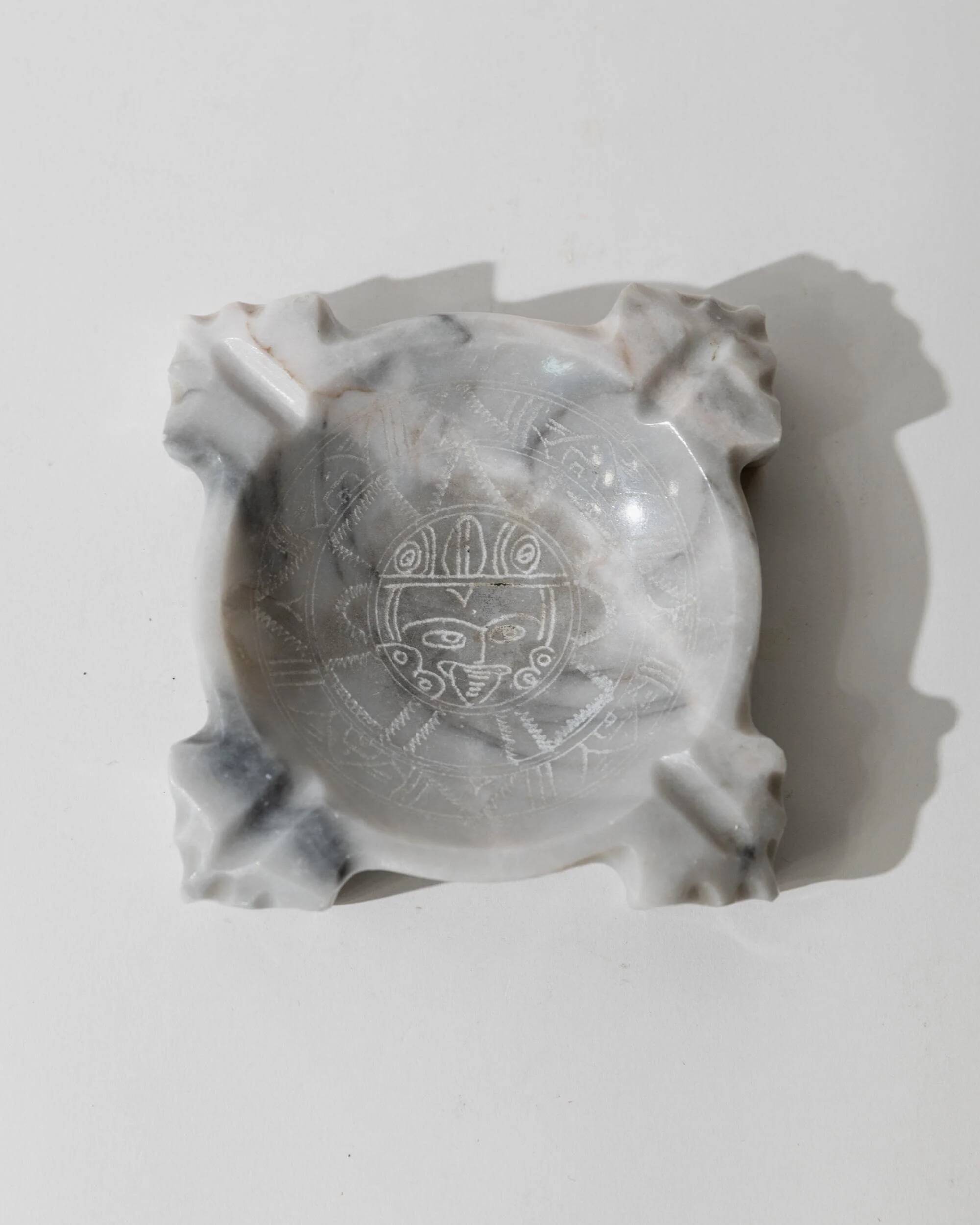 Vintage Mexican marble ashtray from the 1970s, engraved Aztec pattern.