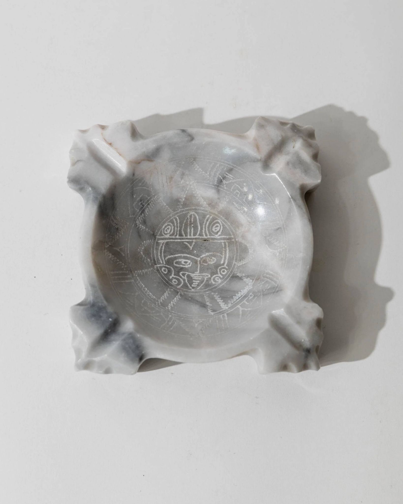 Vintage Mexican marble ashtray from the 1970s, engraved Aztec pattern.