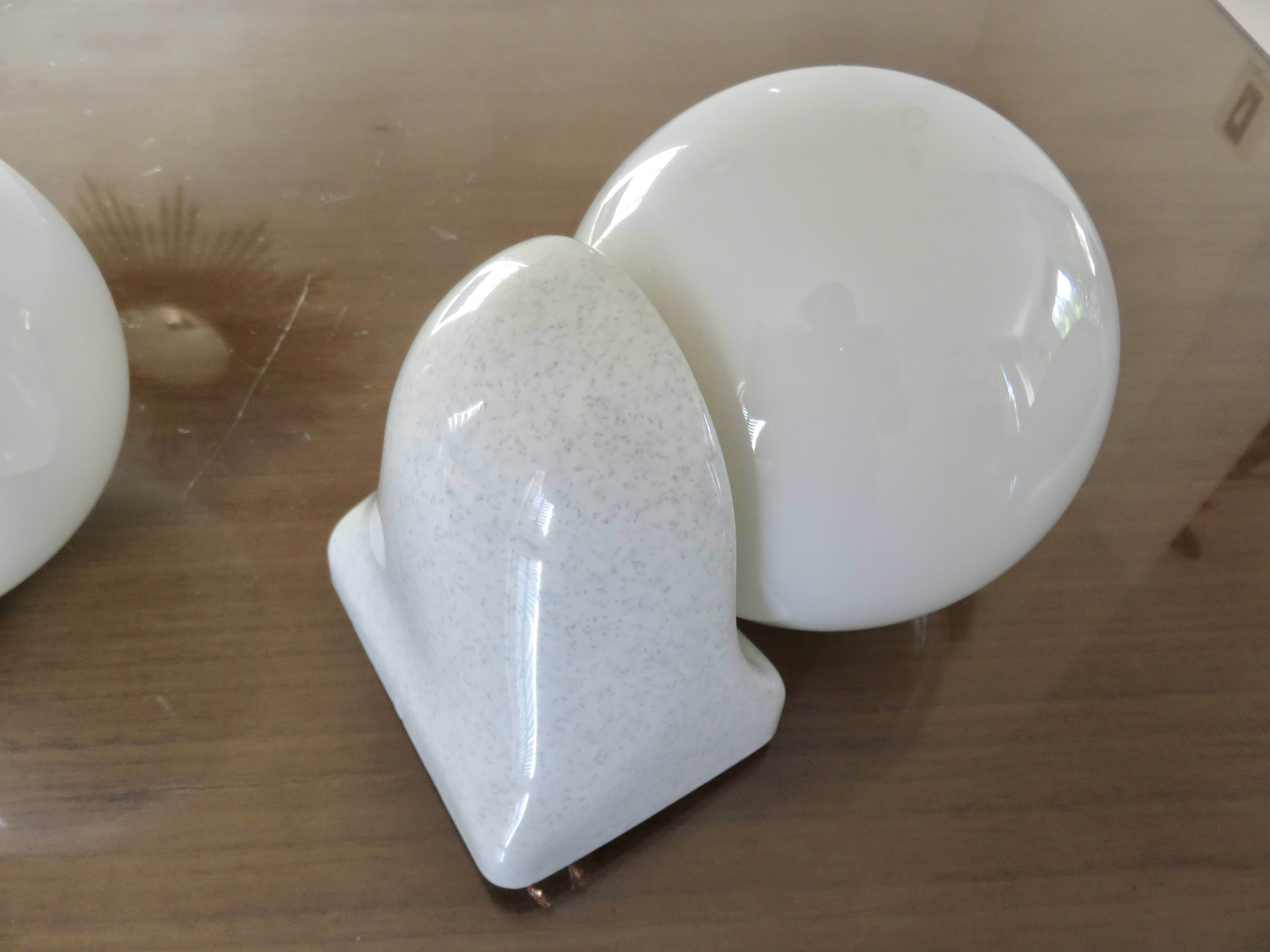 Pair of streamline opaline wall lights from the 80s