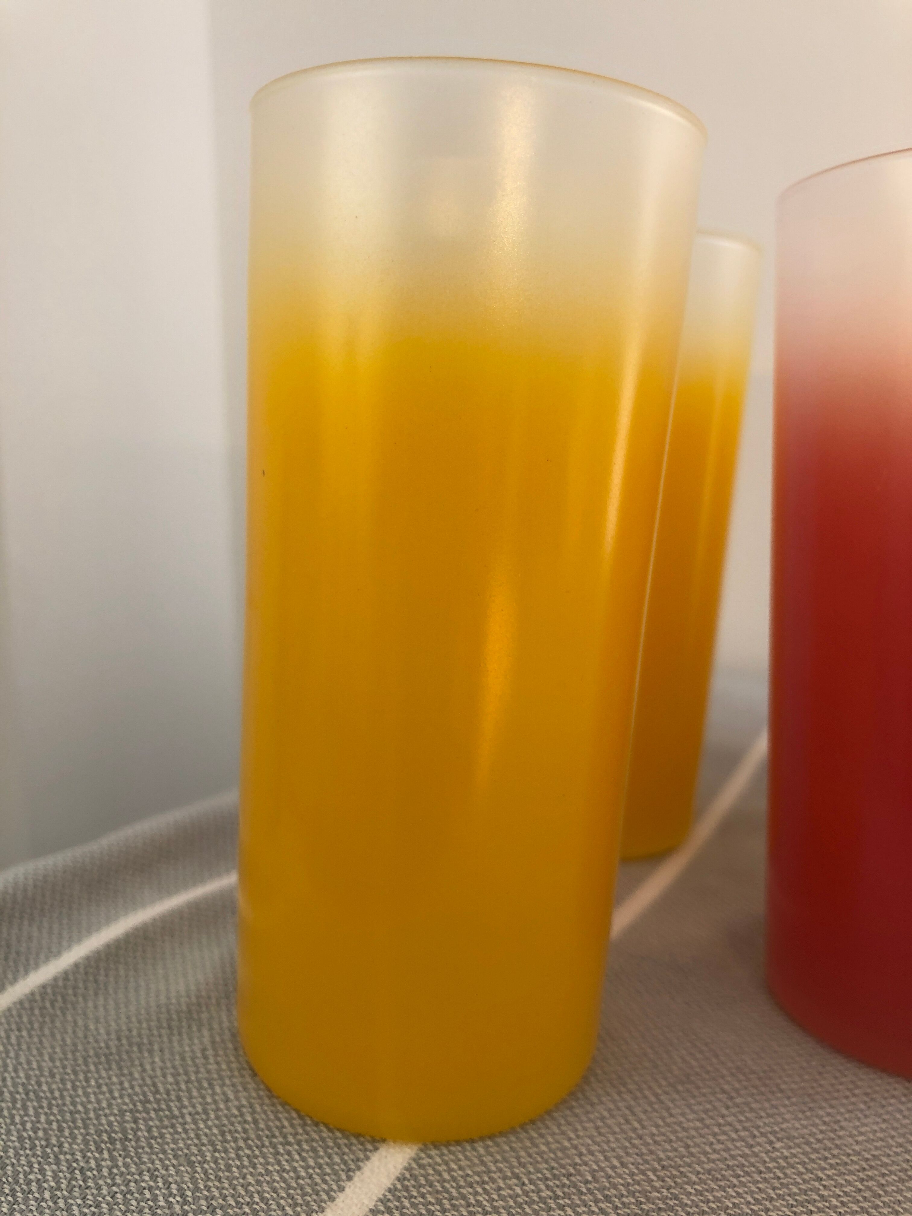 Yellow, red and frosted yellow orangeade glasses made of vintage glass