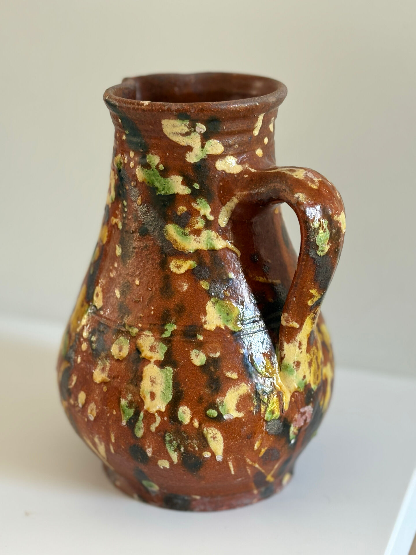 Studio ceramic pitcher with sprayed glazes – circa 1960-70