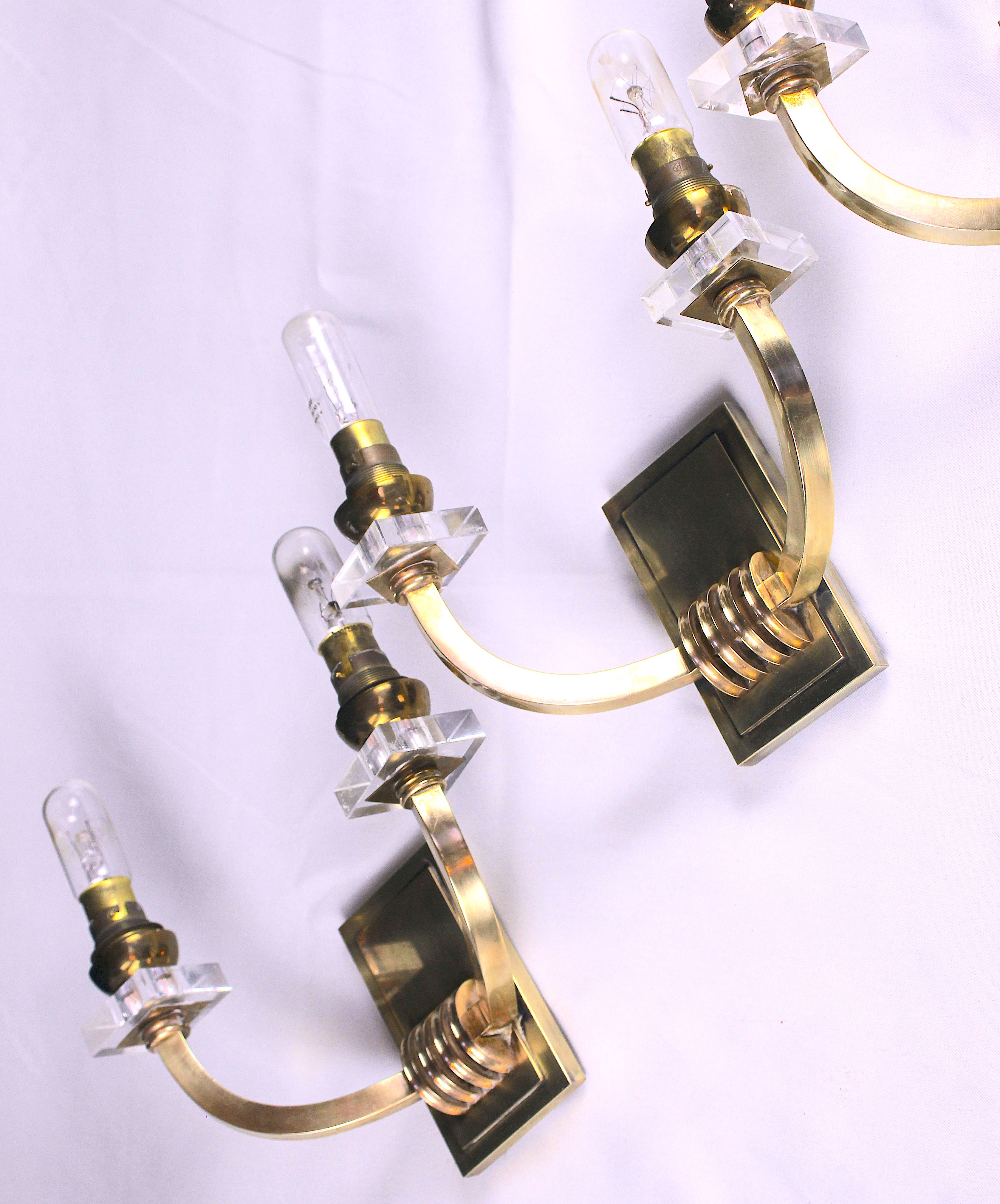 Three double wall lamps  Brass and lucite, France Mid-Century