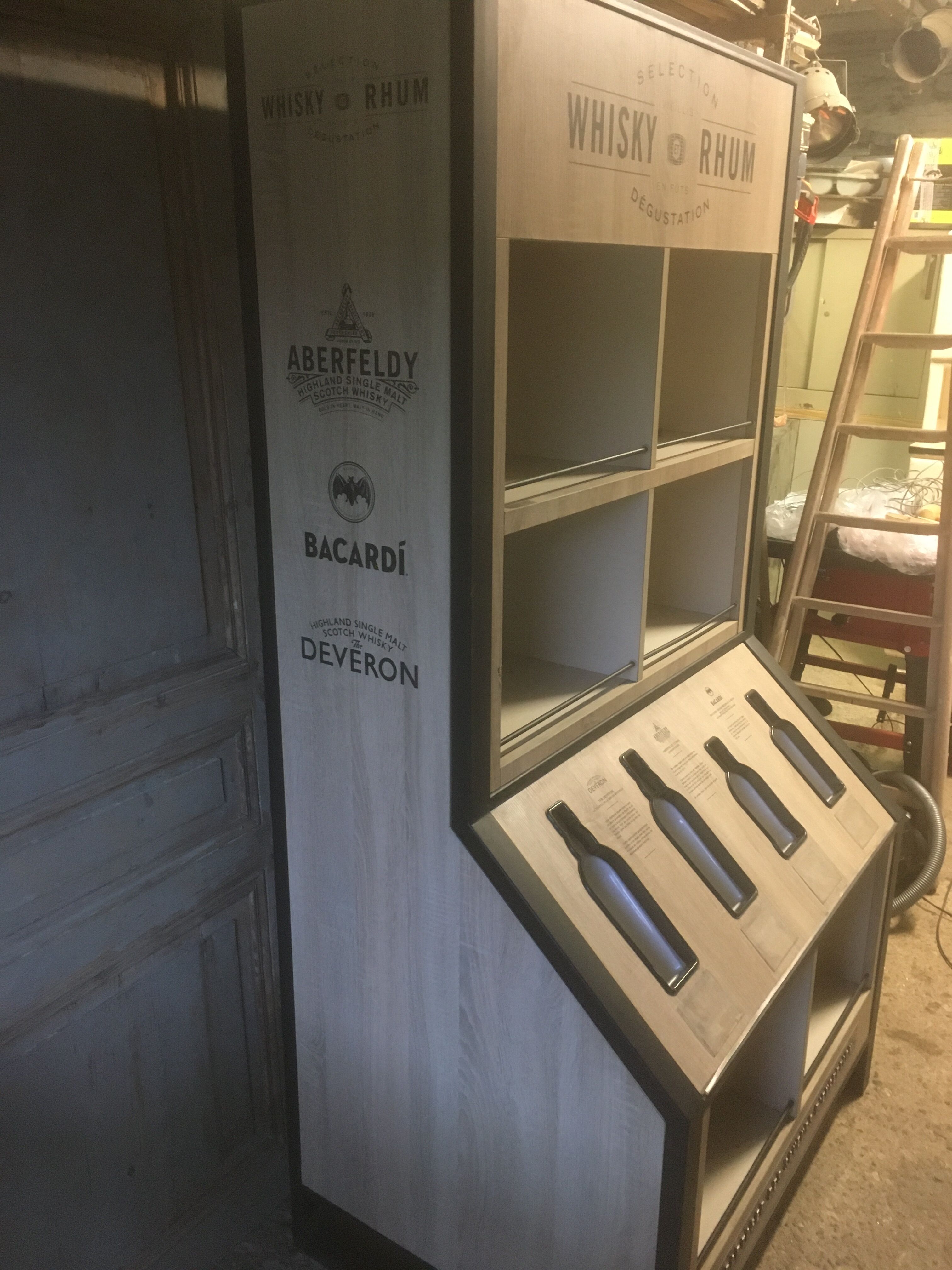 Store display for whisky and rum in metal and melamine