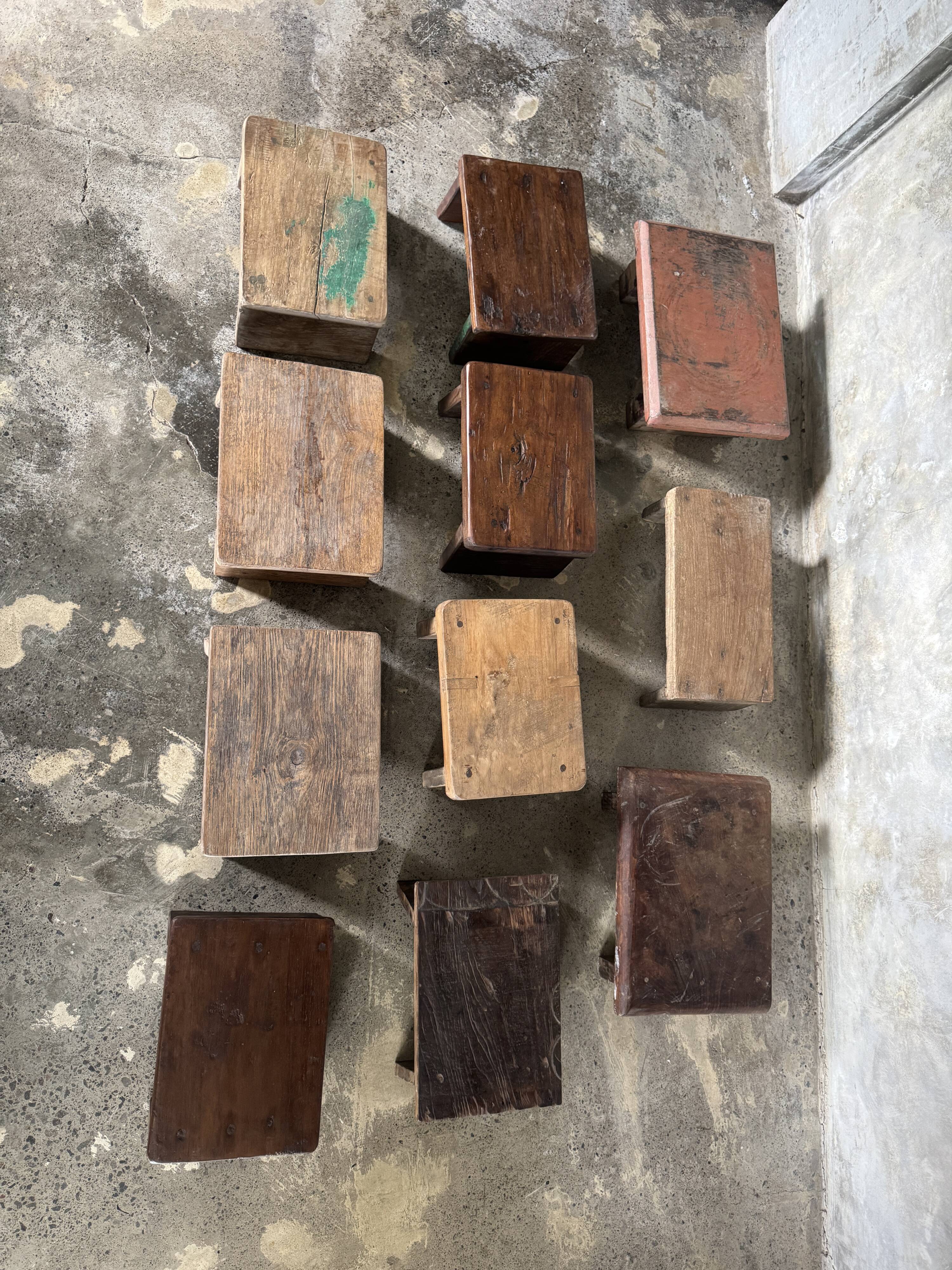 Small auxiliary stool in upcycled teak with traces of green chrome on the leg.