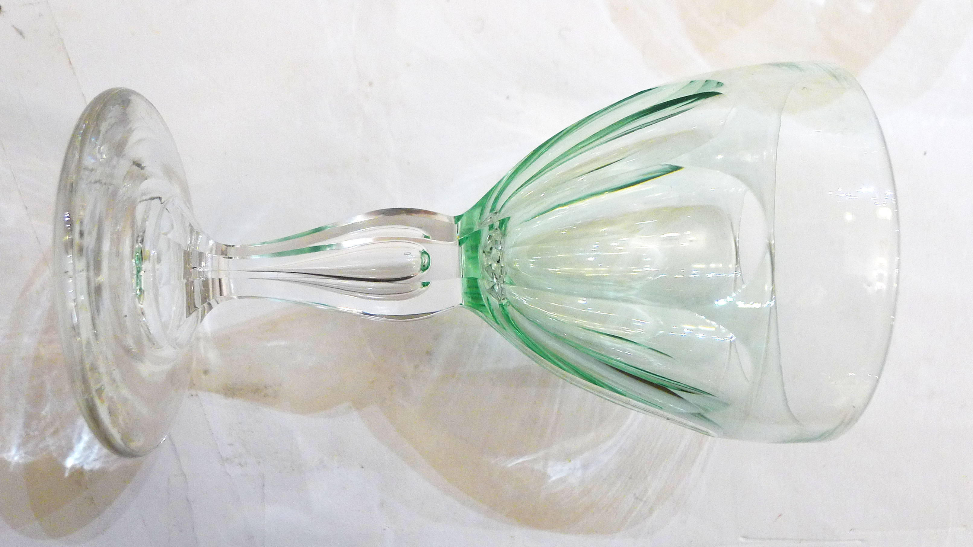 Set of nine glasses on foot in cut glass