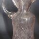 Small blown glass pitcher with bubbles from the 20th century.