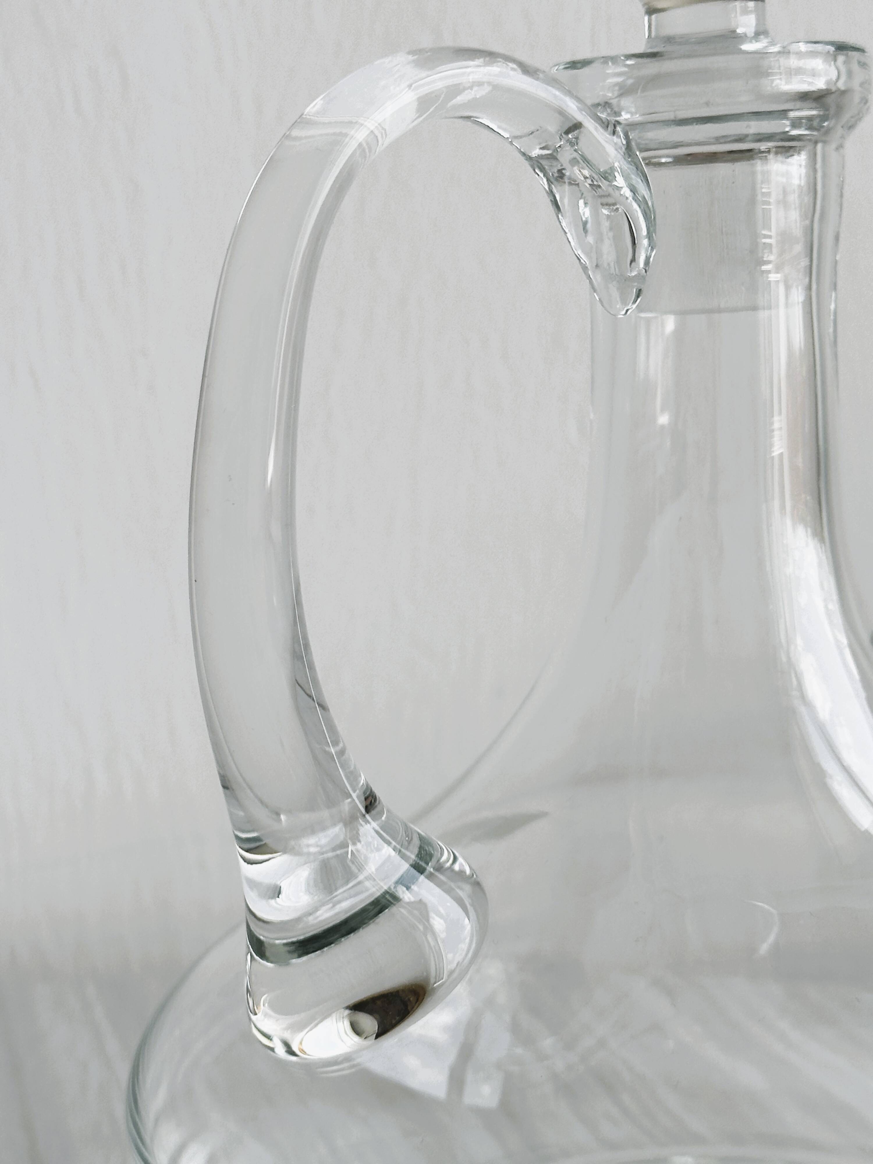 Mouth-blown glass carafe, old glassware.