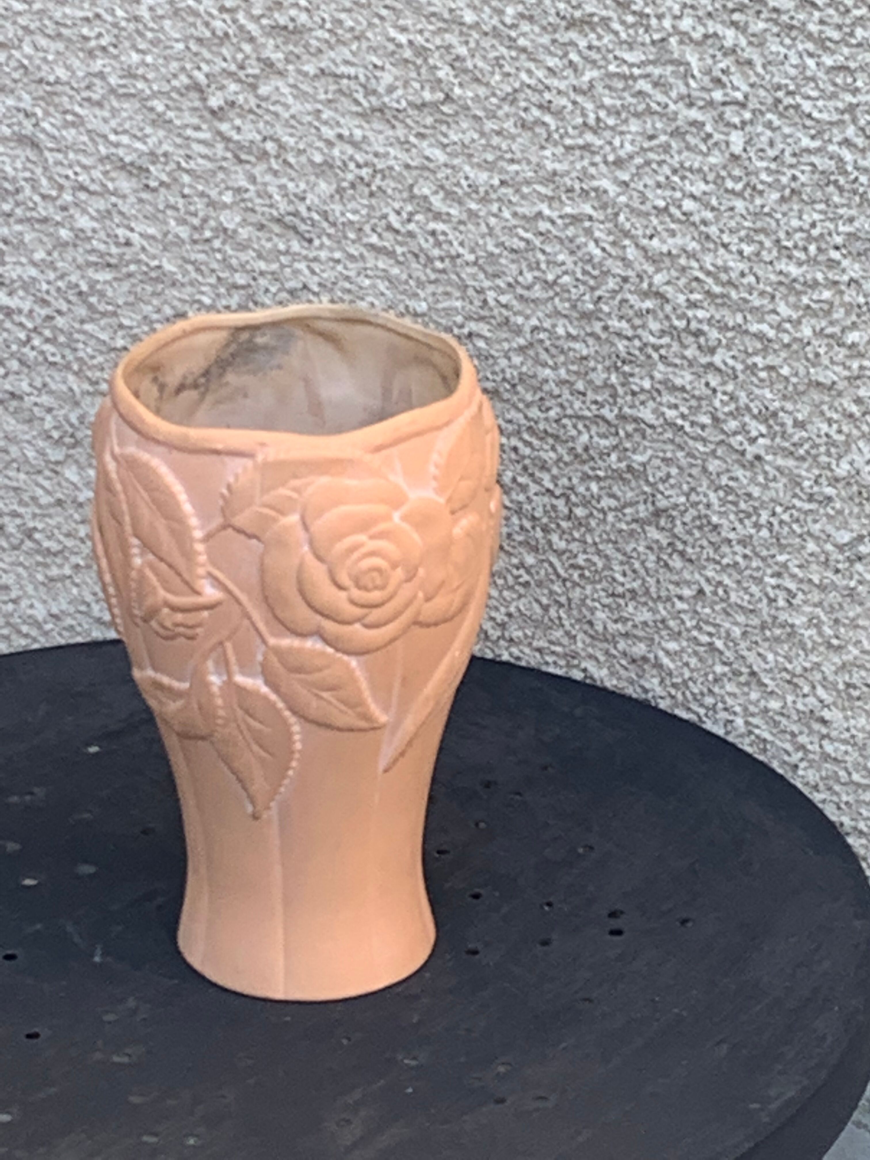 Terracotta vase with a vintage ceramic relief rose pattern