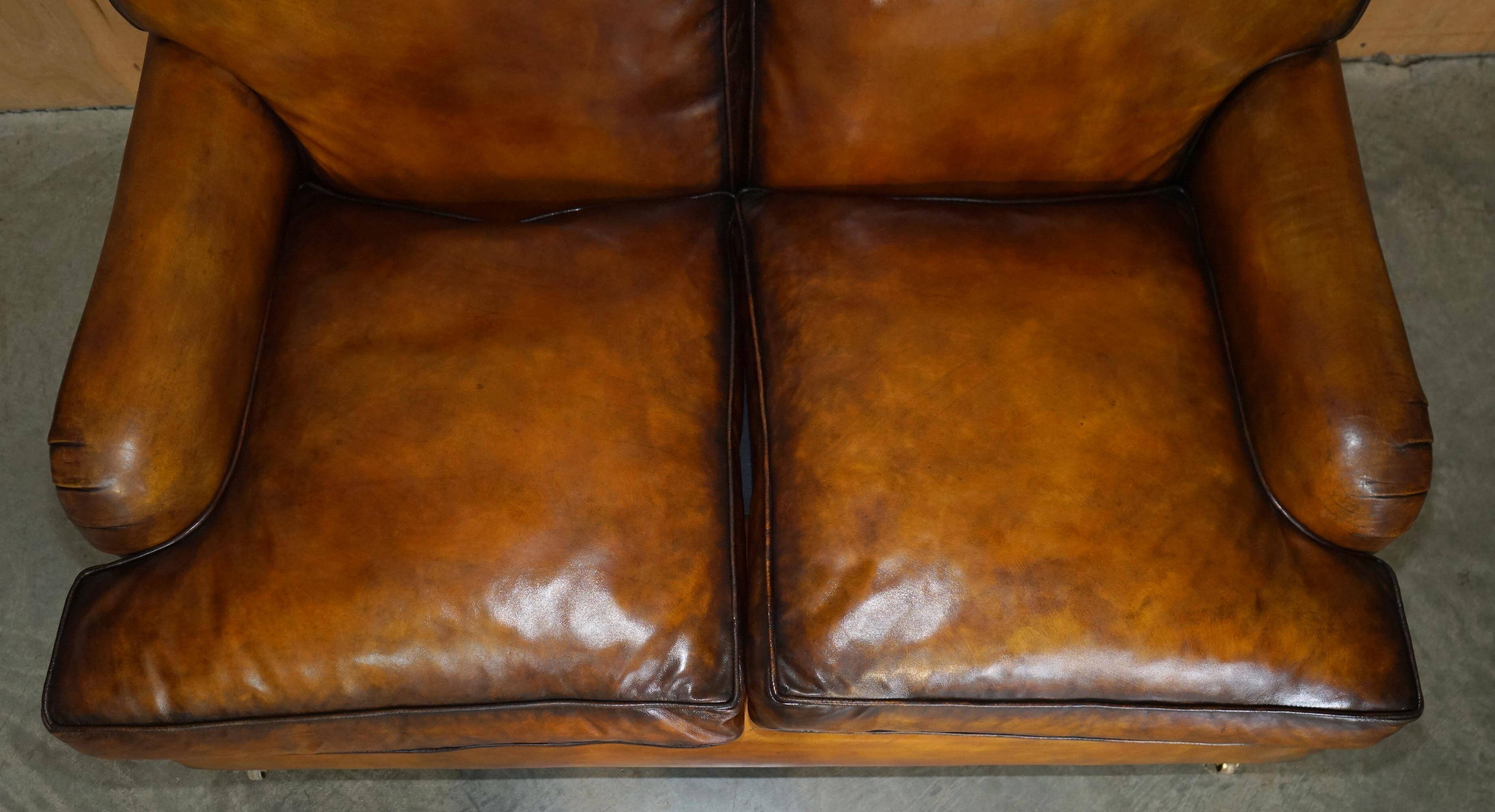 Howard & Son restored leather canapé, width 145 cm