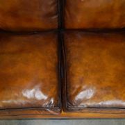 Howard & Son restored leather canapé, width 145 cm