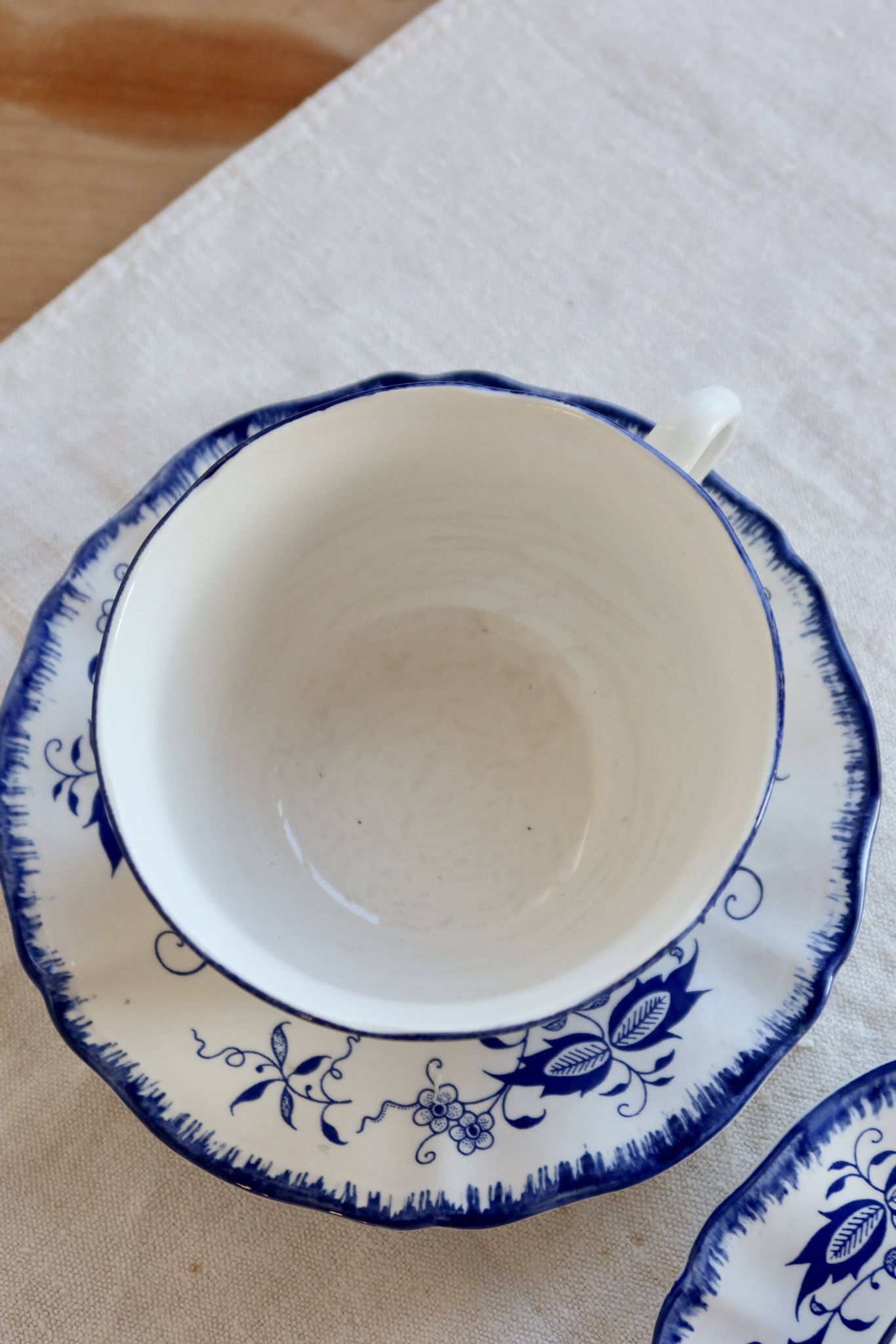 Old Lancaster cups and saucers in white earthenware with blue decoration.