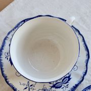 Old Lancaster cups and saucers in white earthenware with blue decoration.
