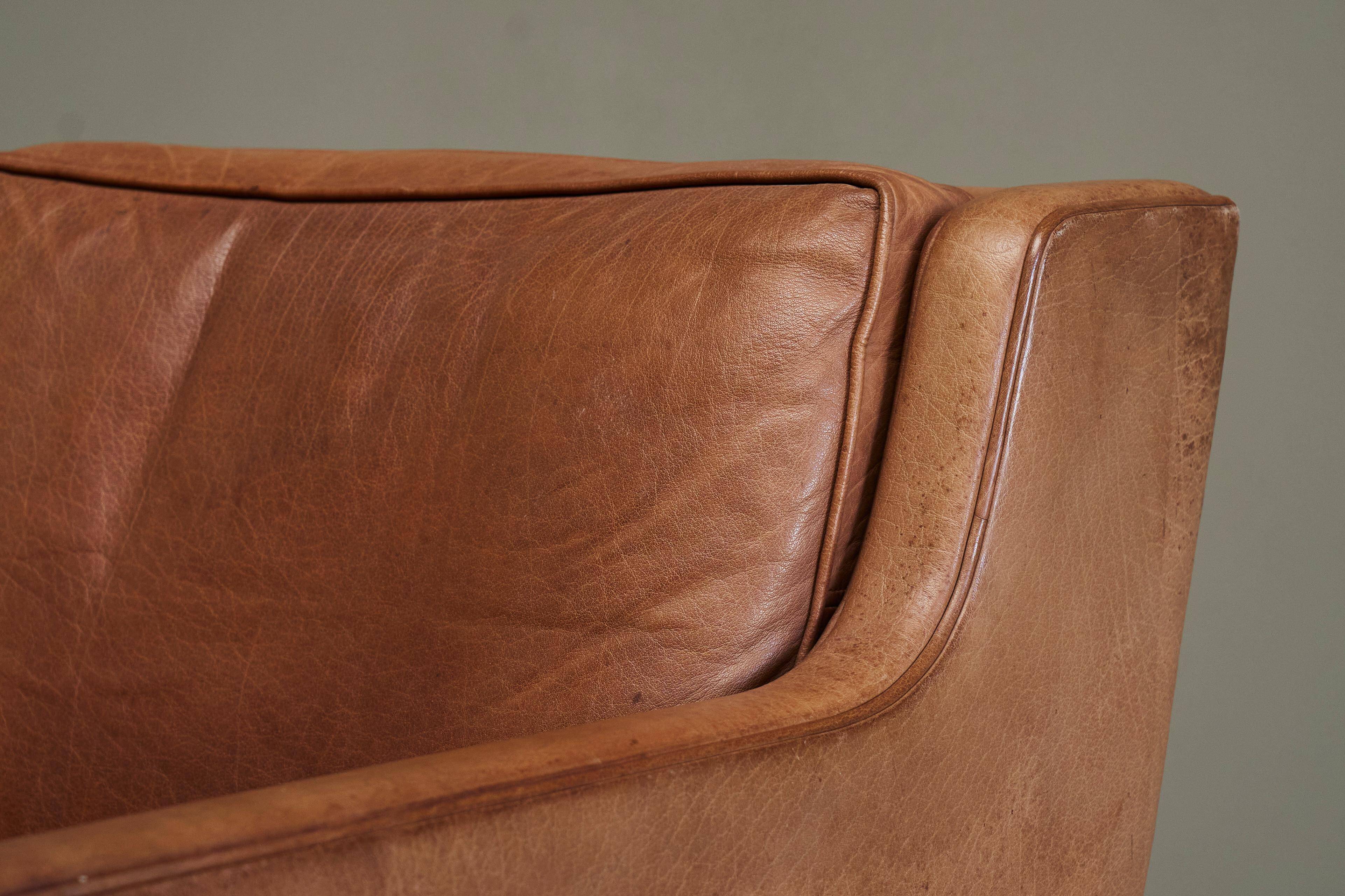 1970s patinated leather Scandinavian lounge chair