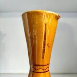 Ocher glazed ceramic pitcher