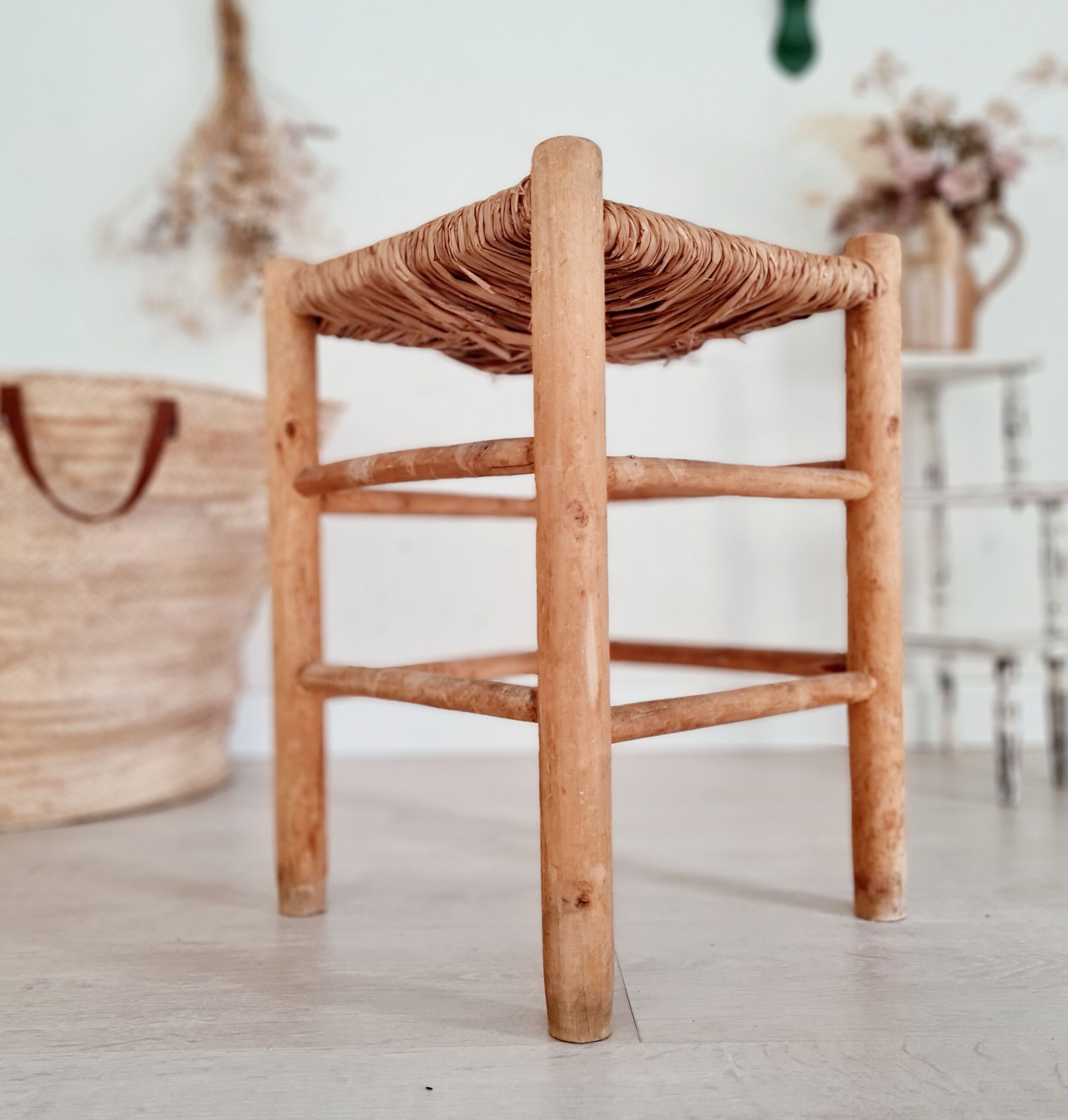 Old stool in wood and straw brutalist look