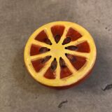 Vintage salt shaker in the shape of an orange marked ermetic