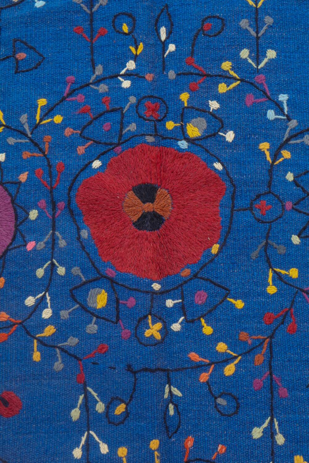 Midnight blue suzani kilim rug with embroidered patterns