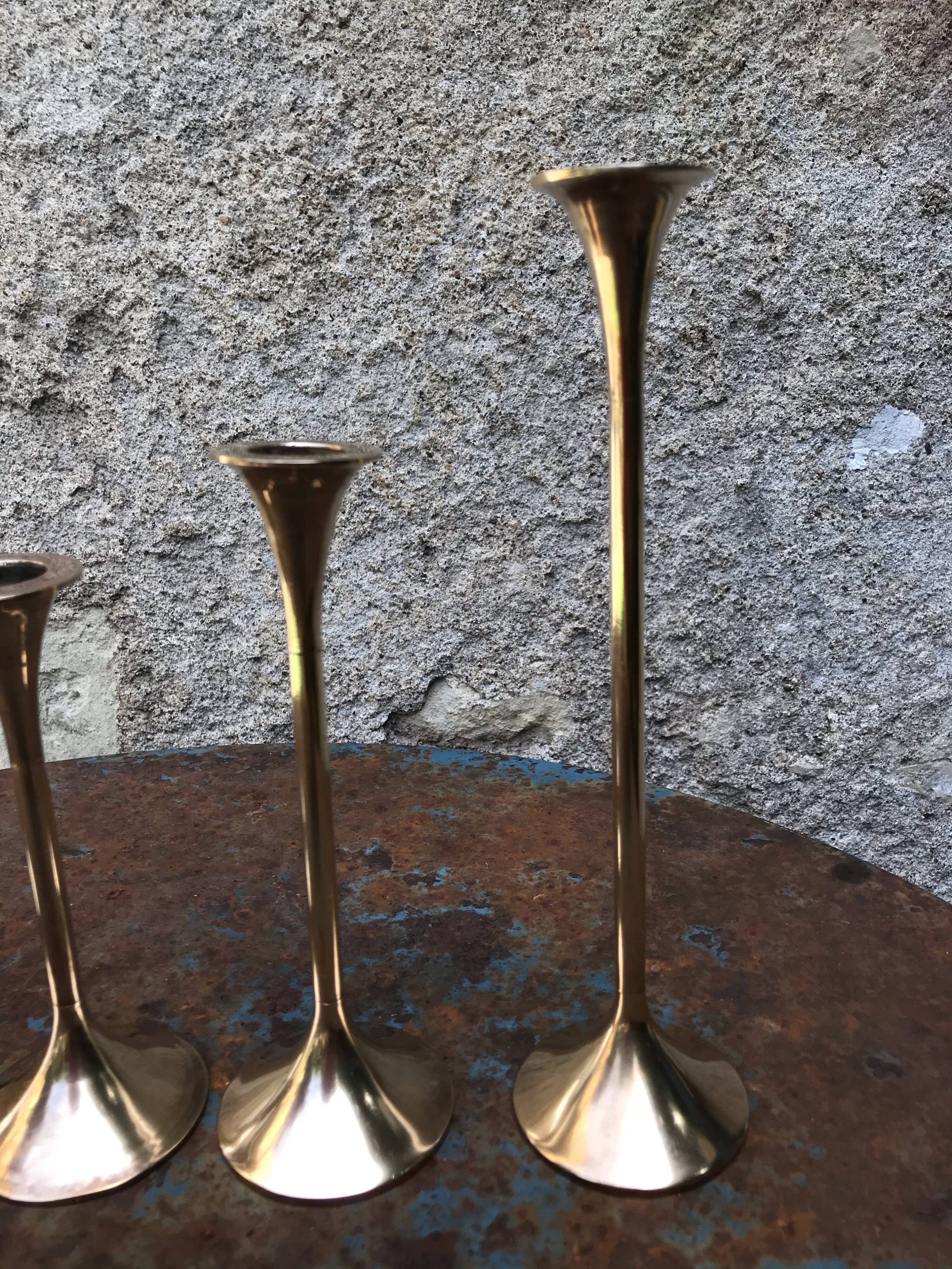Series of 5 brass candlesticks