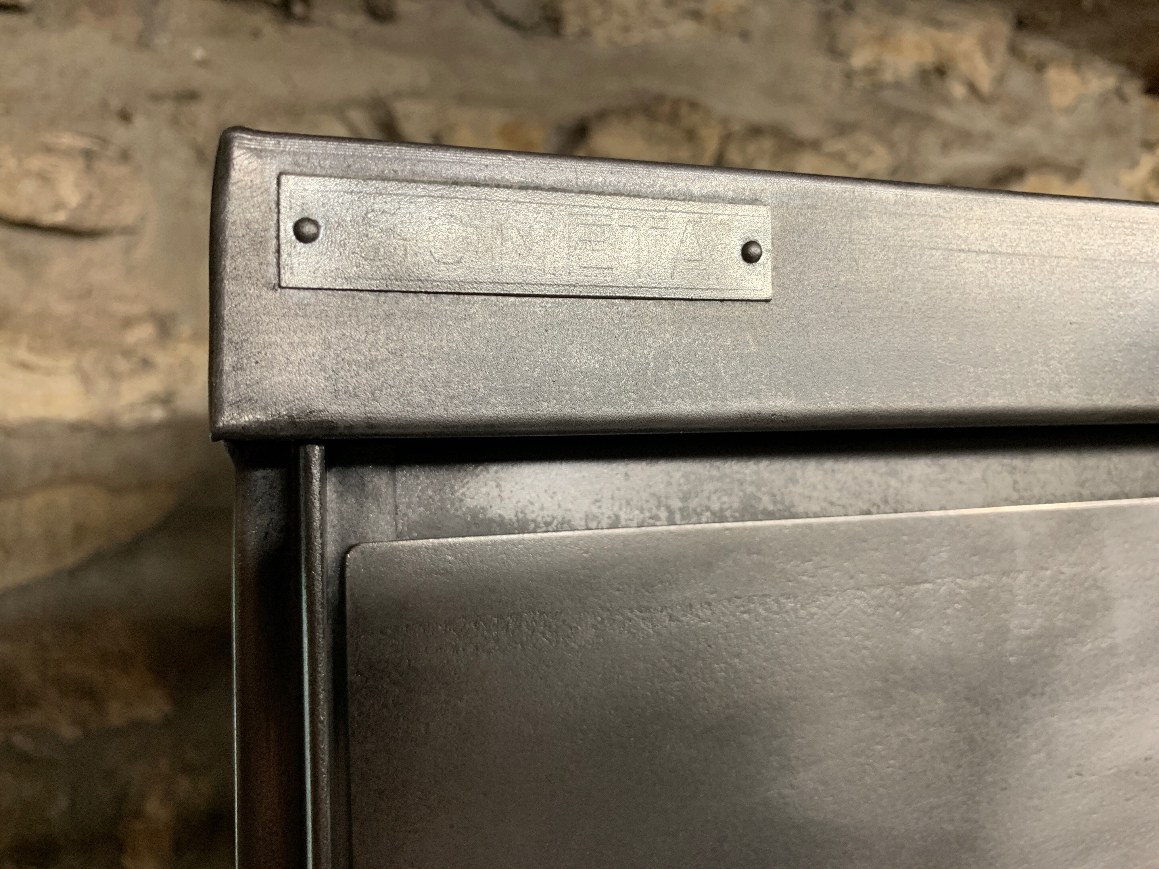 Industrial cladding furniture in brushed and patinated steel
