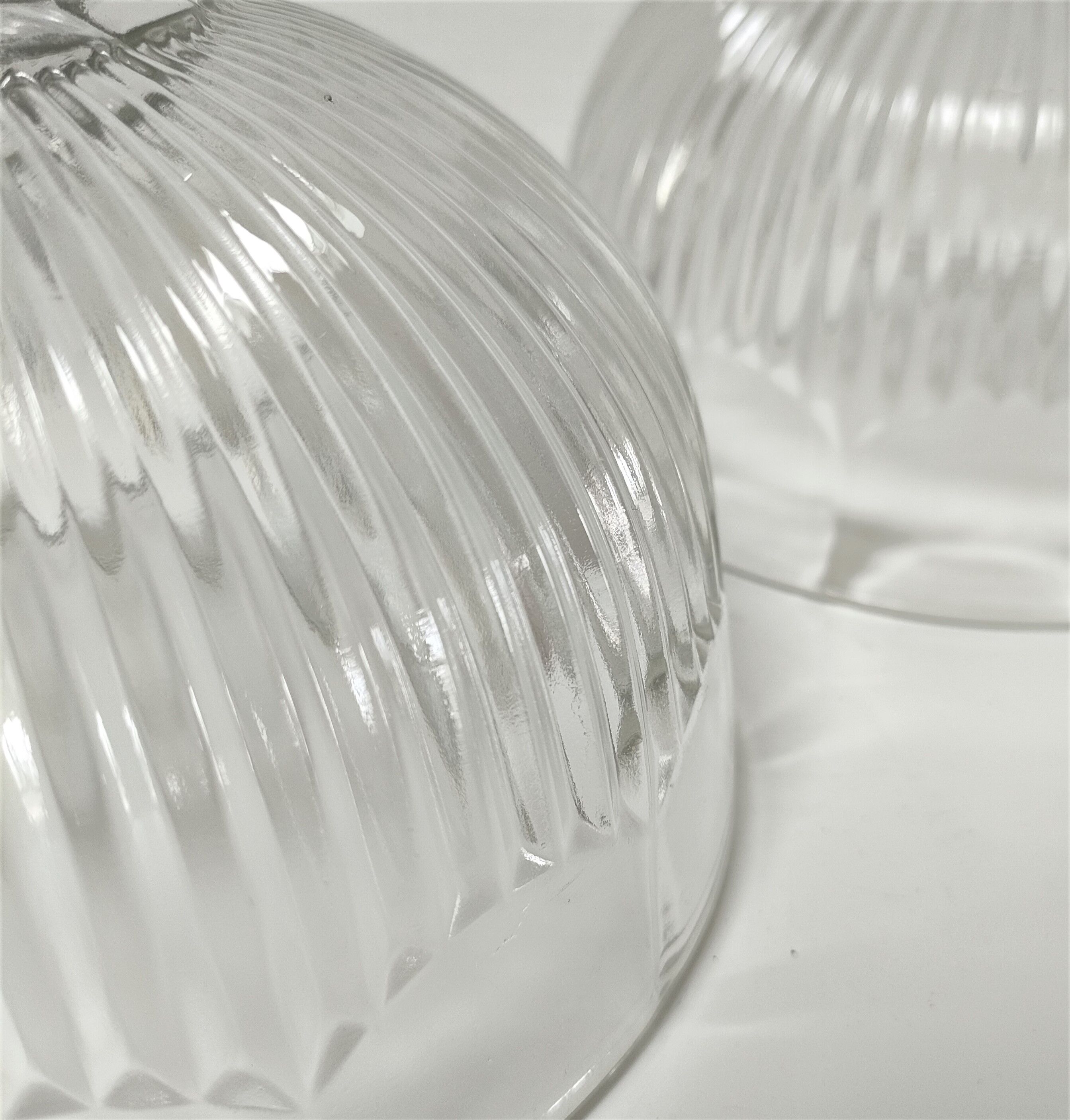 Two cheese bells molded pressed glass striated Art Deco style early twentieth century