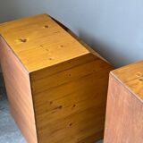 Pair of handcrafted solid wood bedside tables with drop-down doors.