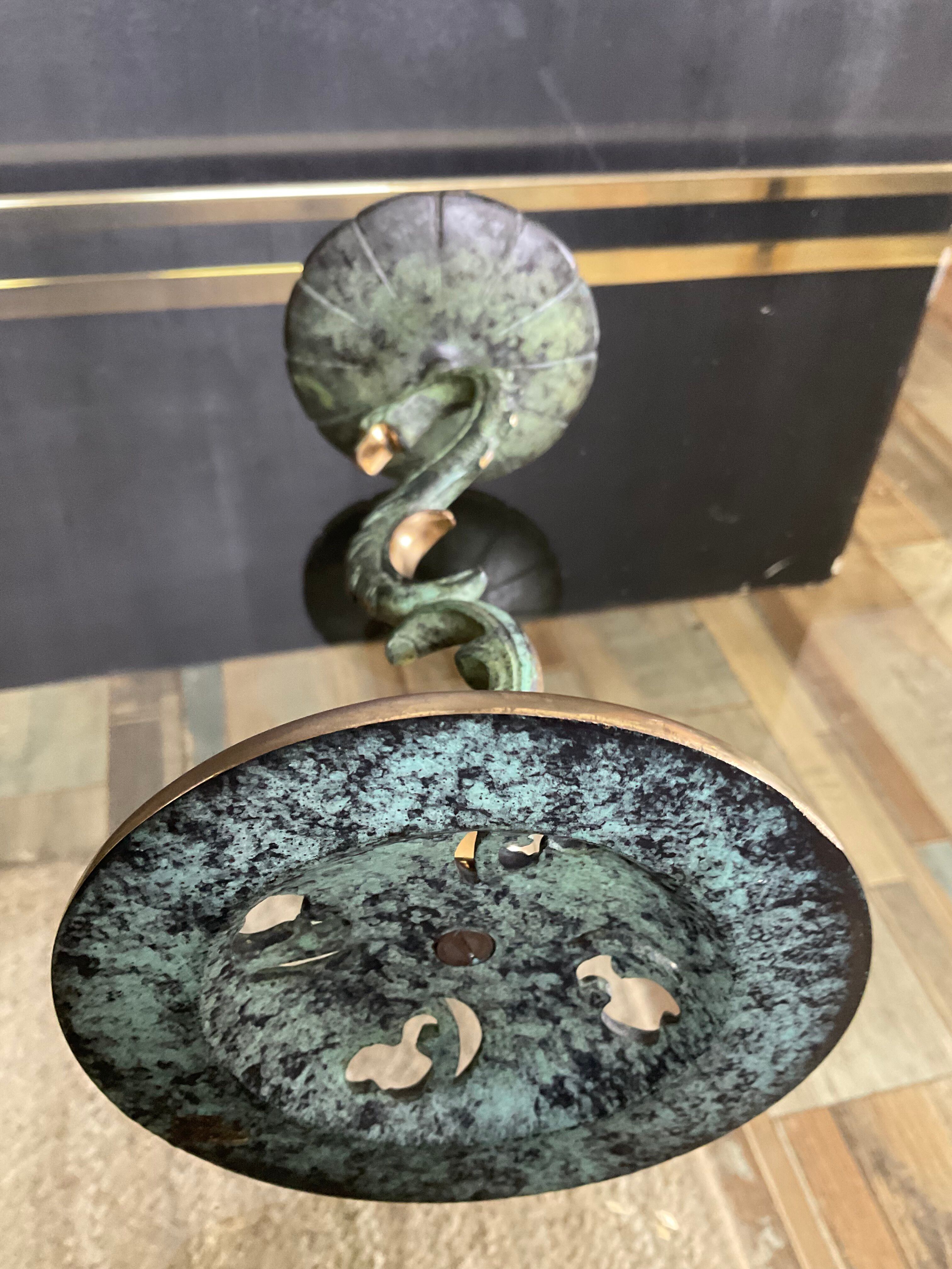 Empire style bronze candlestick with a candle holder