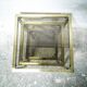 Trio of nesting tables in brass and smoked glass
