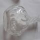Cut crystal oil bottle with its crystal stopper.
