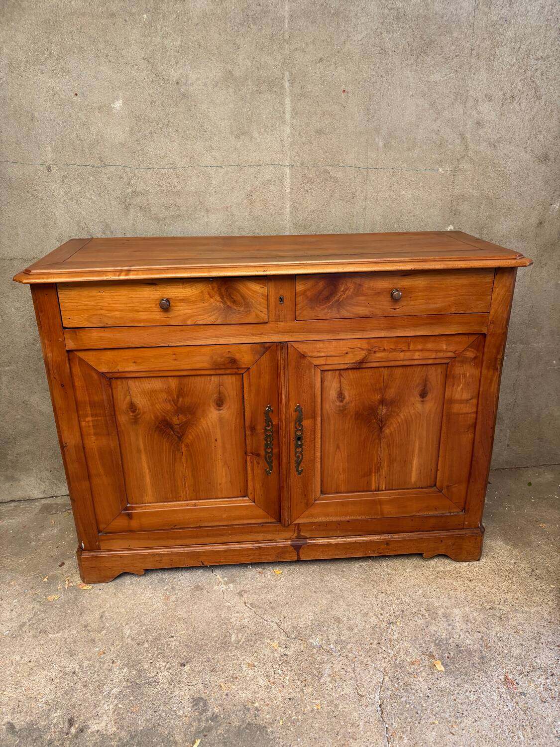 Small cherry wood sideboard in golden honey color