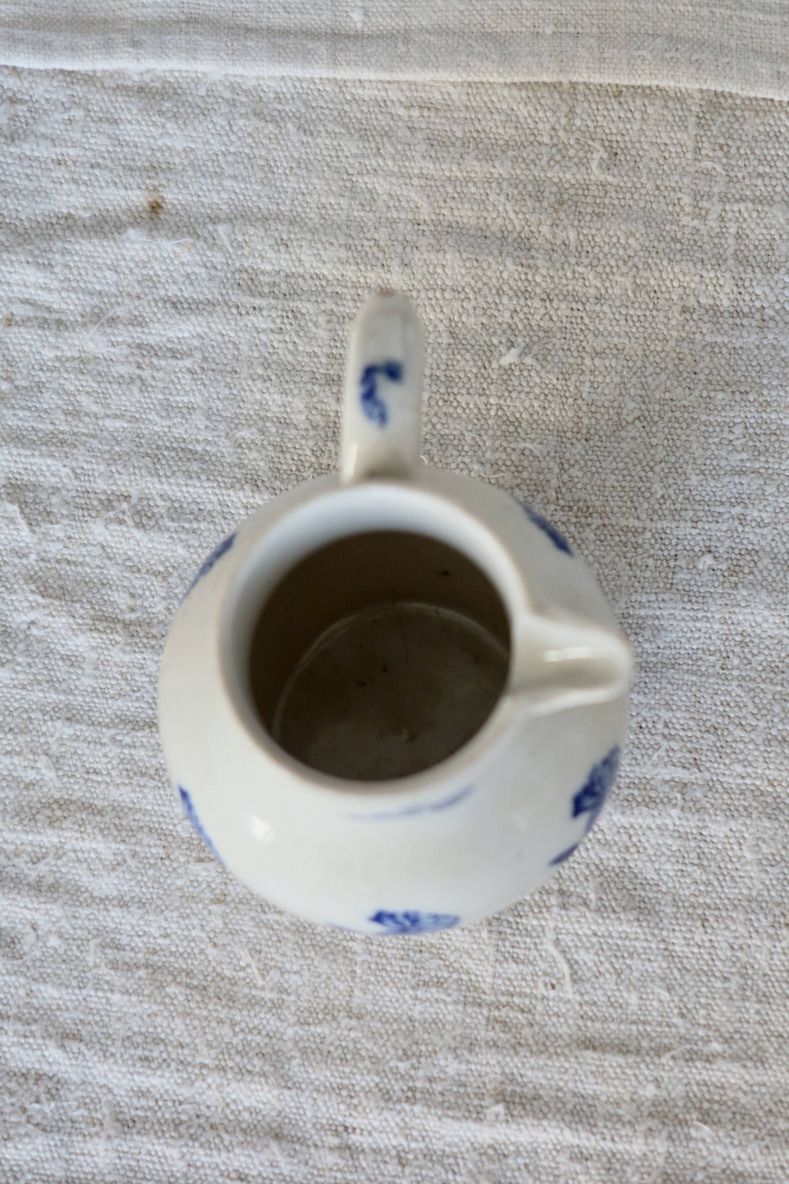 Antique Saint-Uze steel clay pitcher with cobalt blue floral pattern