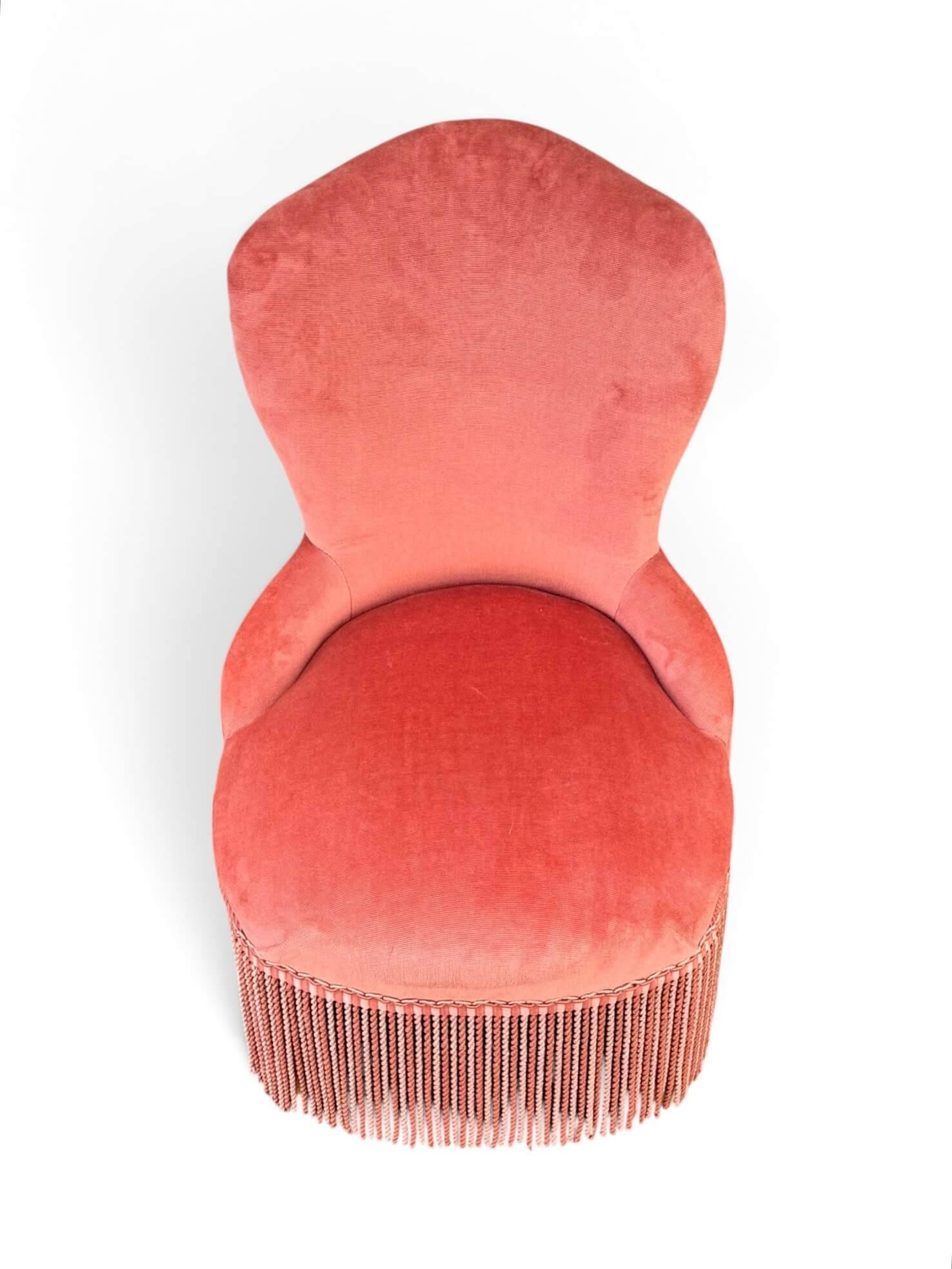 Vintage pink velvet fringed armchair