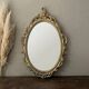 Oval mirror in Baroque style
