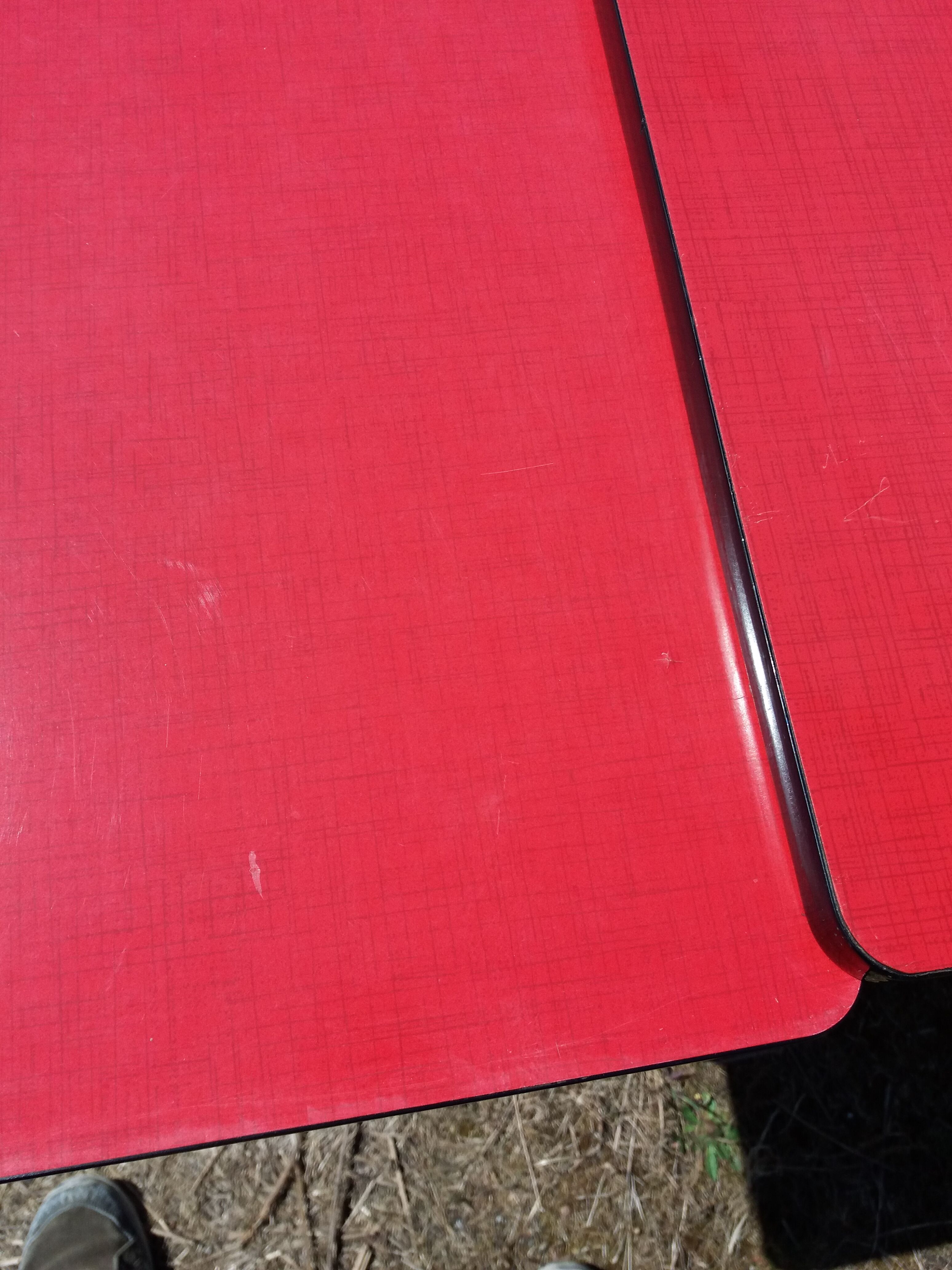 Dining table with red formica extensions