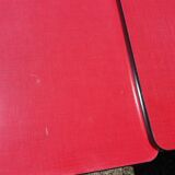 Dining table with red formica extensions