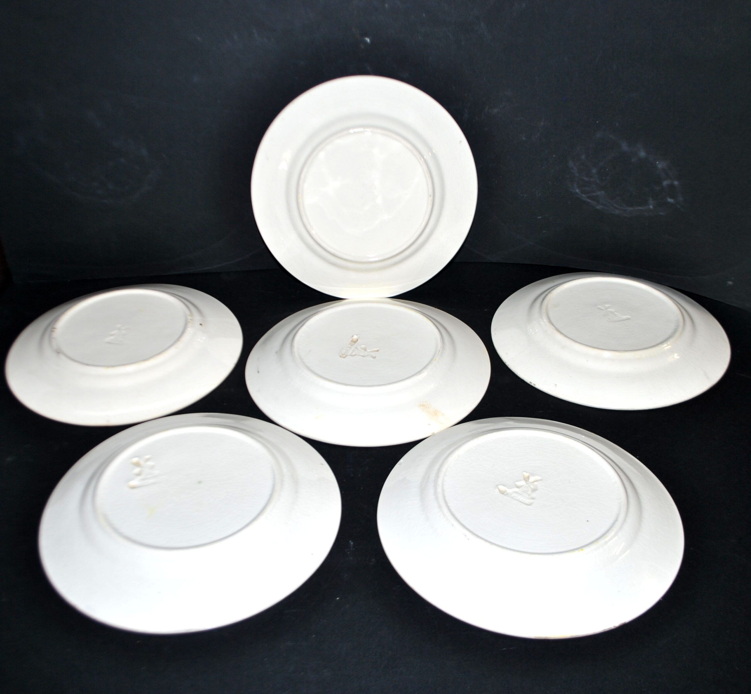 Orchies set of 6 yellow earthenware dessert plates with stencilled fruit decoration.