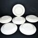 Orchies set of 6 yellow earthenware dessert plates with stencilled fruit decoration.